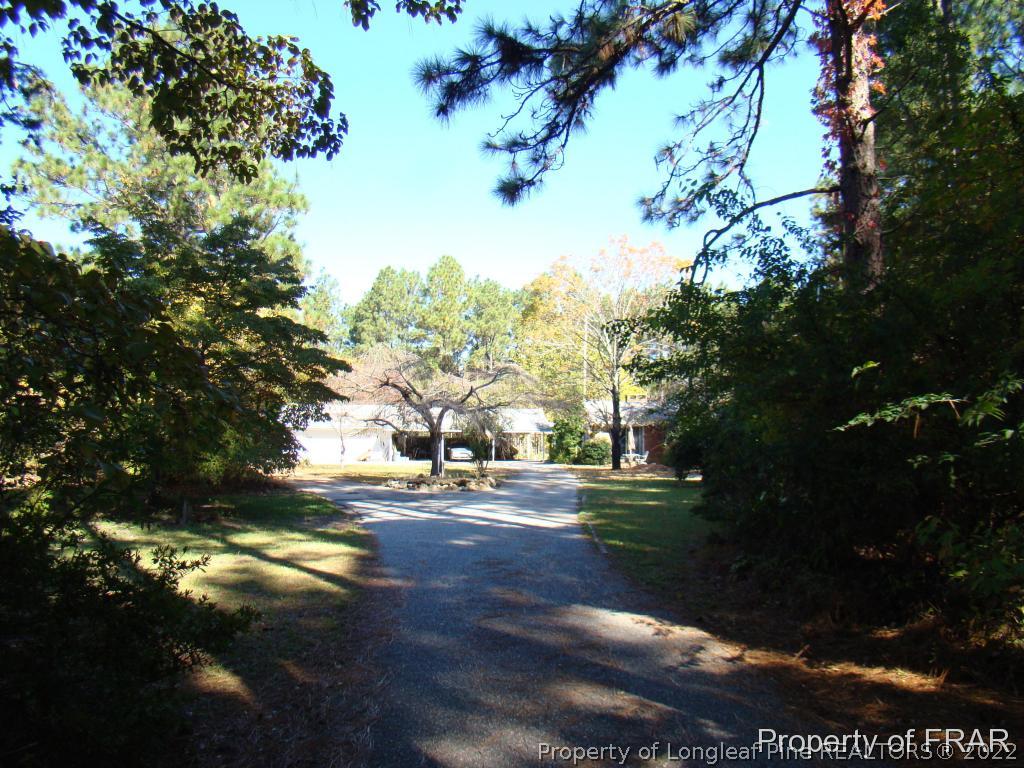 1615 Midland Road Southern Pines, NC 28387 - Photo 9 of 12 a view of a yard in front of the house