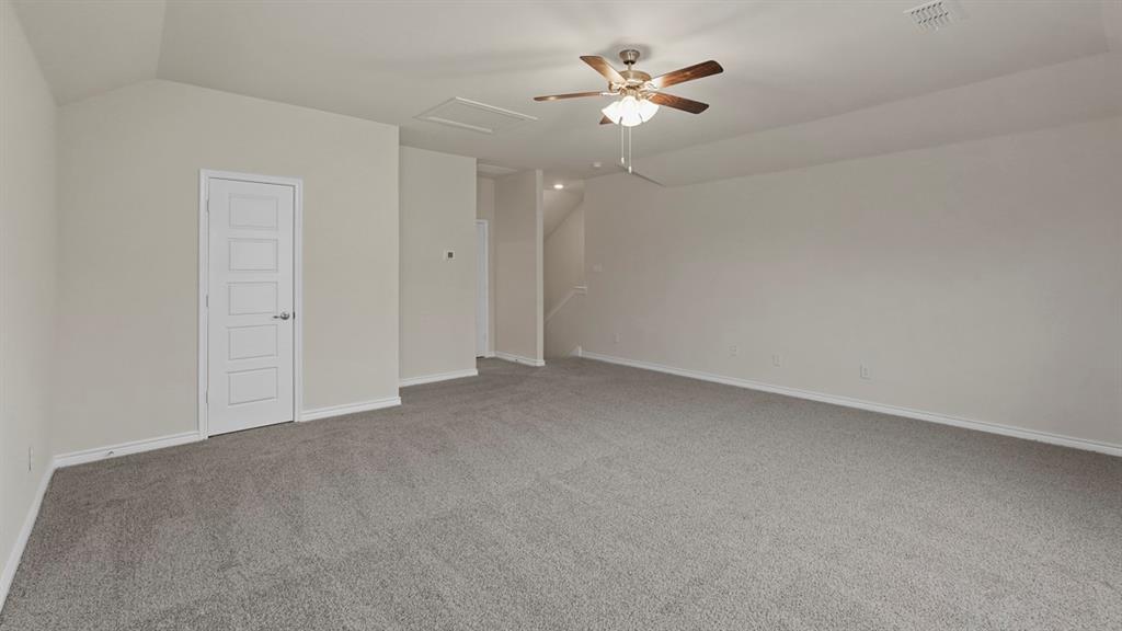 2424 Palo Pinto Trail Pilot Point, TX 76258 - Photo 19 of 39 an empty room with chandelier fan and windows