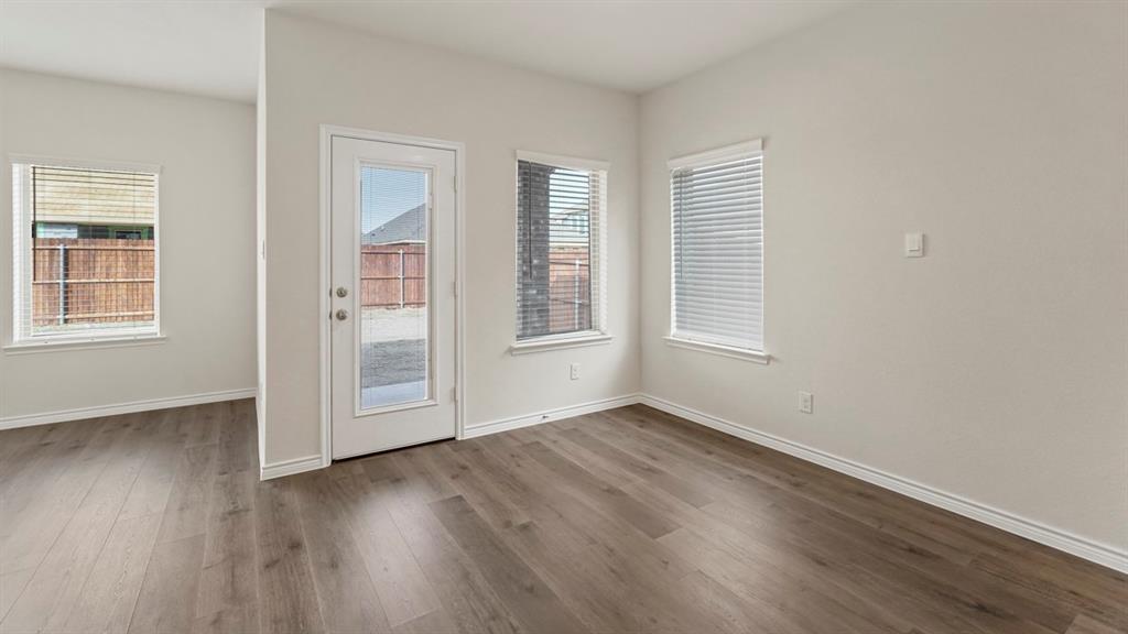 2424 Palo Pinto Trail Pilot Point, TX 76258 - Photo 29 of 39 an empty room with wooden floor and windows