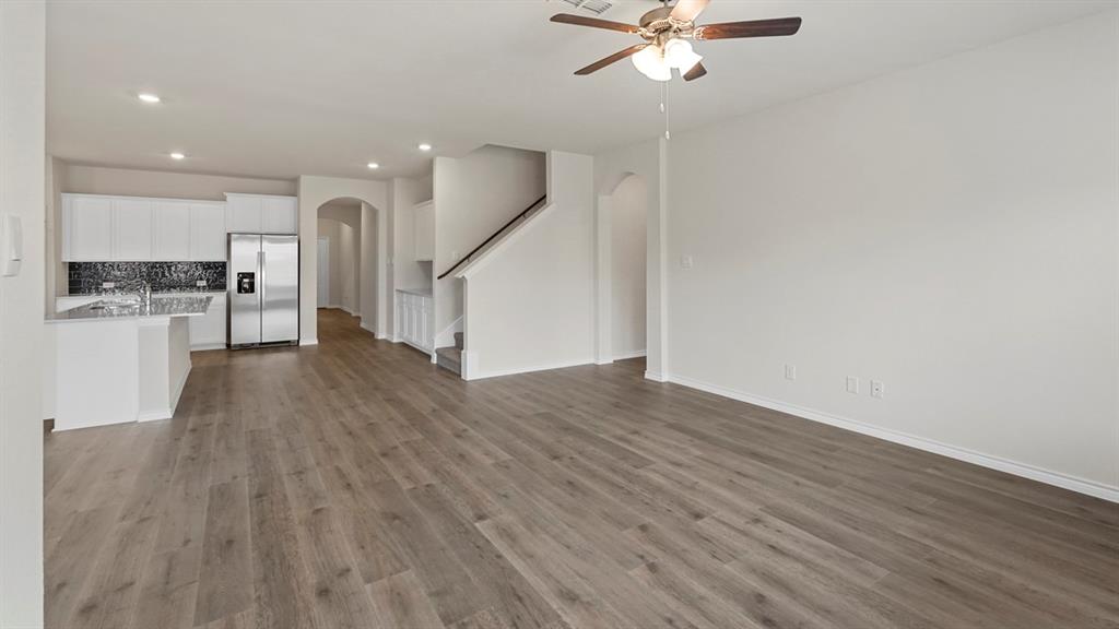 2424 Palo Pinto Trail Pilot Point, TX 76258 - Photo 33 of 39 a view of a hallway with wooden floor and a chandelier