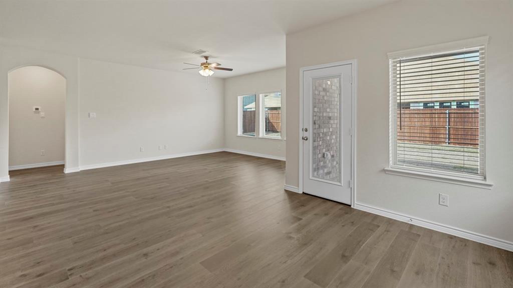 2424 Palo Pinto Trail Pilot Point, TX 76258 - Photo 34 of 39 a view of an empty room with wooden floor and a window