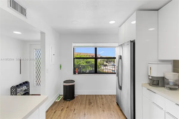 a room with a window and wooden floor