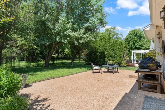 a view of a backyard with sitting area