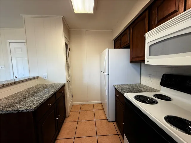 a bathroom with a sink toilet tub and shower