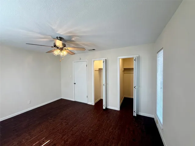 a view of a livingroom with wooden floor