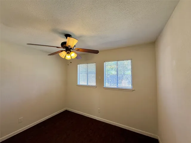 a picture of a room with a fan