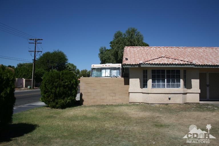 68520 Concepcion Road Cathedral City, CA 92234 - Photo 2 of 7 a front view of a house with a garden