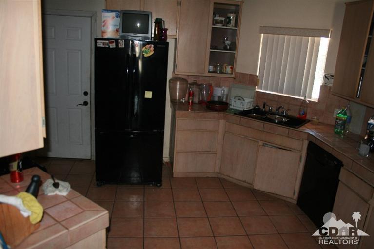 68520 Concepcion Road Cathedral City, CA 92234 - Photo 4 of 7 a kitchen with a sink and cabinets