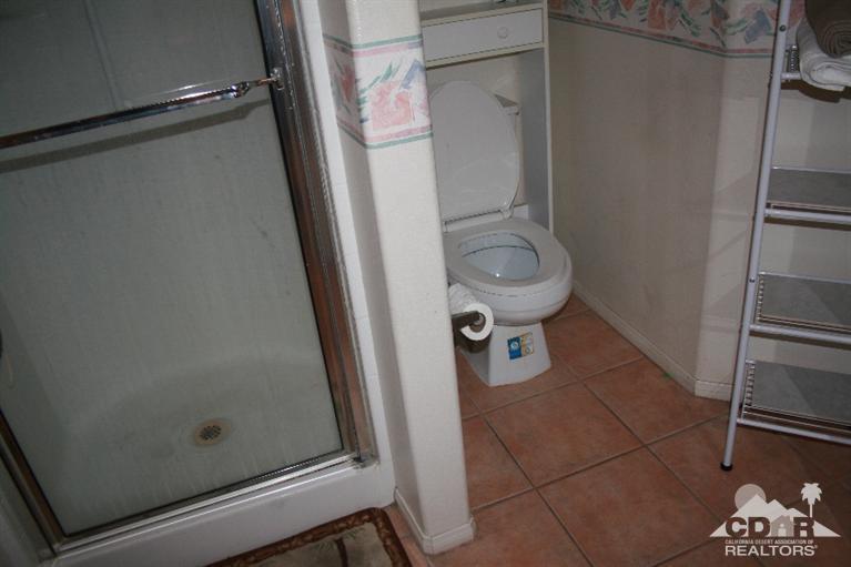 68520 Concepcion Road Cathedral City, CA 92234 - Photo 5 of 7 a bathroom with a shower and toilet