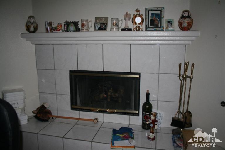 68520 Concepcion Road Cathedral City, CA 92234 - Photo 6 of 7 a living room with furniture and a fireplace