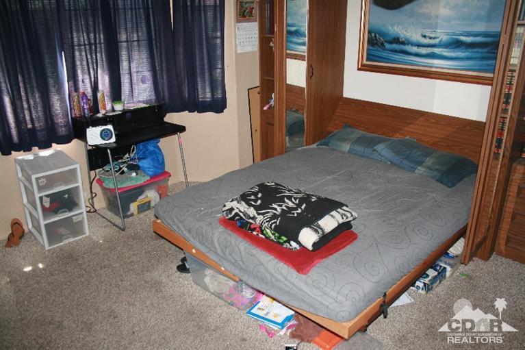 68520 Concepcion Road Cathedral City, CA 92234 - Photo 7 of 7 a living room with furniture and a window