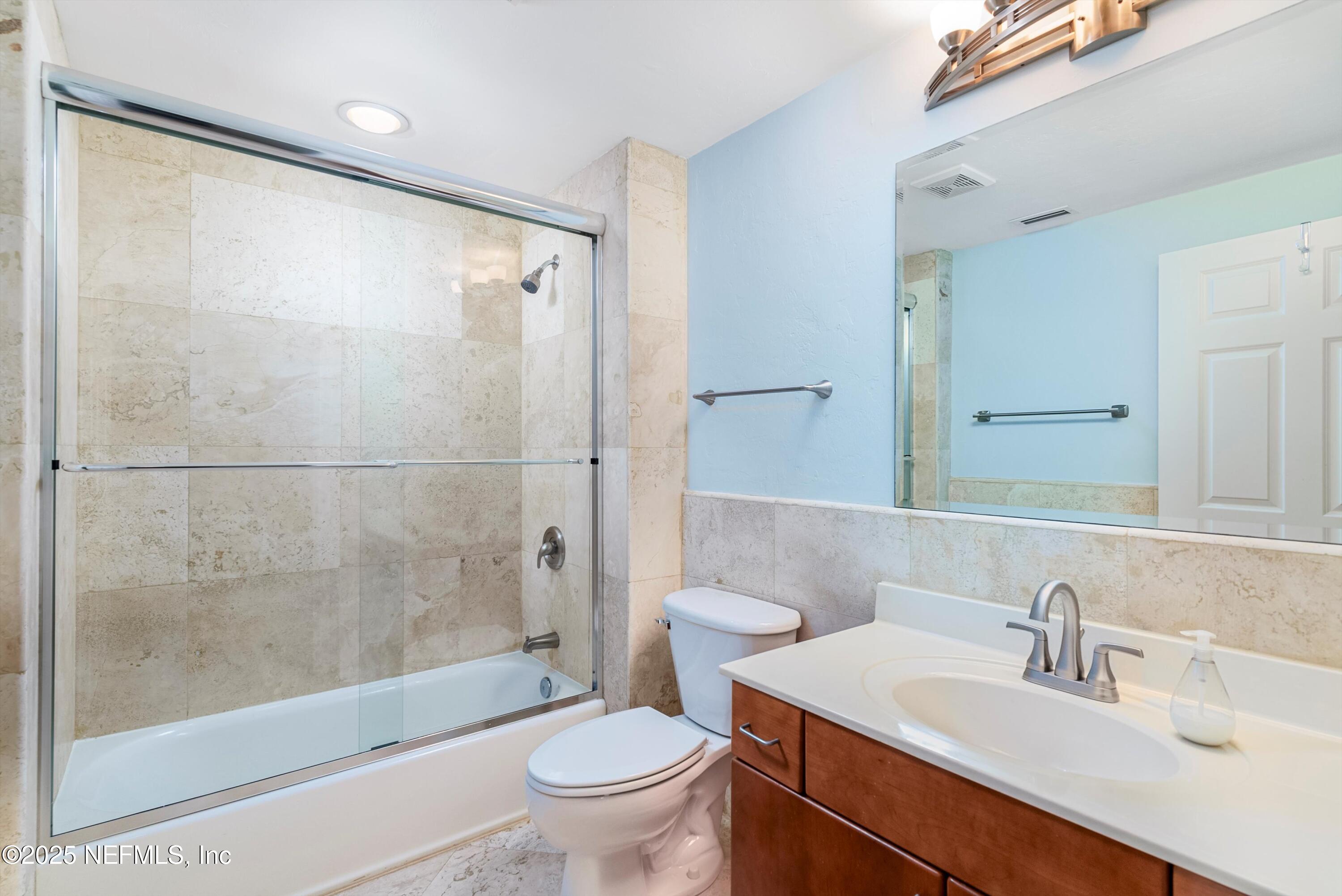 7790 A1A South, Unit 104 St. Augustine, FL 32080 - Photo 12 of 51 a bathroom with a sink toilet and shower