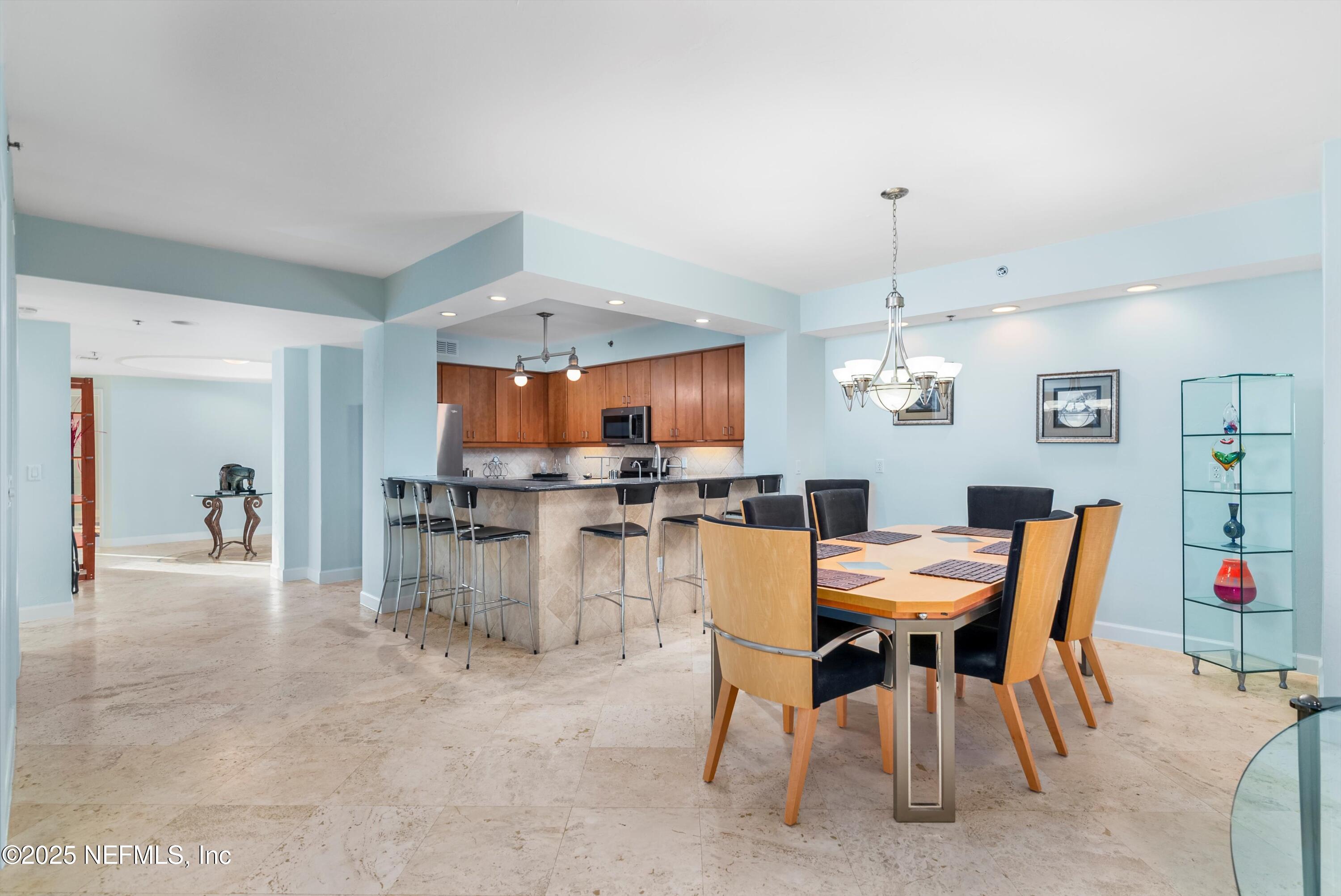 7790 A1A South, Unit 104 St. Augustine, FL 32080 - Photo 23 of 51 a view of a dining room with furniture