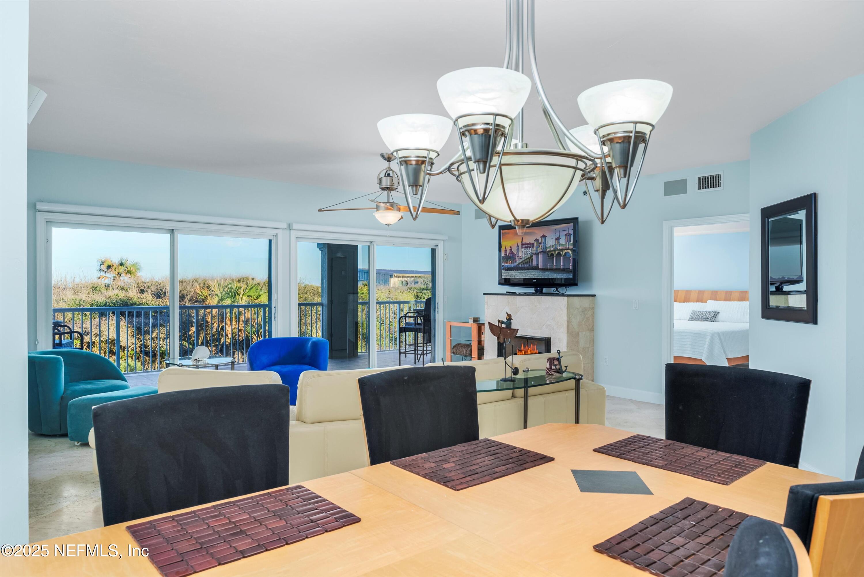 7790 A1A South, Unit 104 St. Augustine, FL 32080 - Photo 24 of 51 a view of a livingroom with furniture and a table