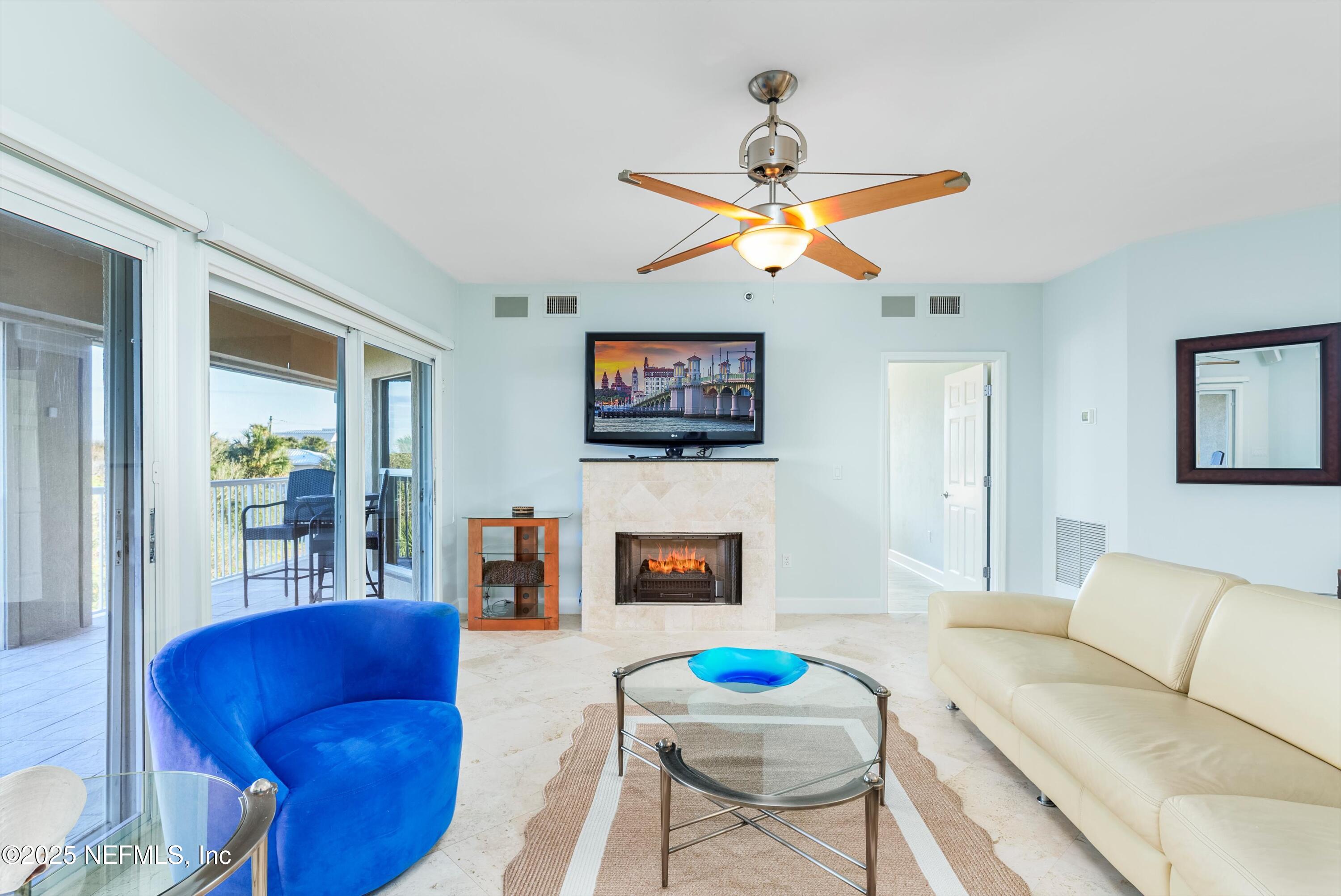 7790 A1A South, Unit 104 St. Augustine, FL 32080 - Photo 27 of 51 a living room with furniture and a flat screen tv