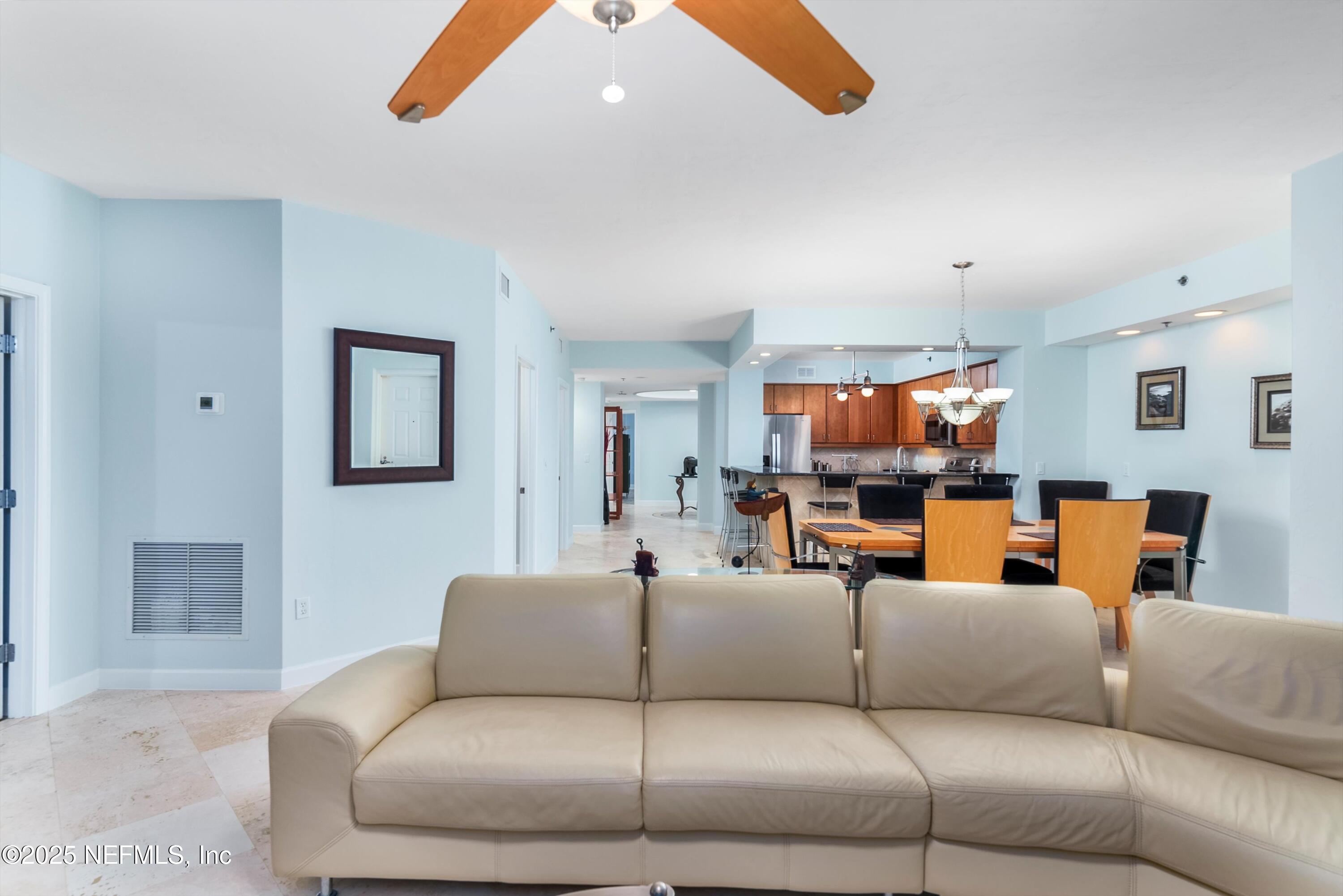 7790 A1A South, Unit 104 St. Augustine, FL 32080 - Photo 29 of 51 a living room with furniture and a flat screen tv