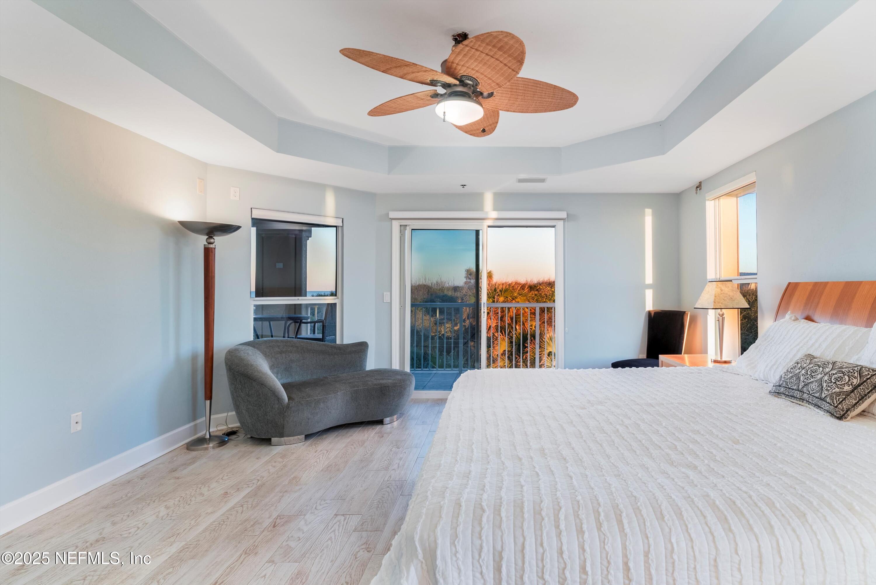 7790 A1A South, Unit 104 St. Augustine, FL 32080 - Photo 32 of 51 a bedroom with a bed and furniture