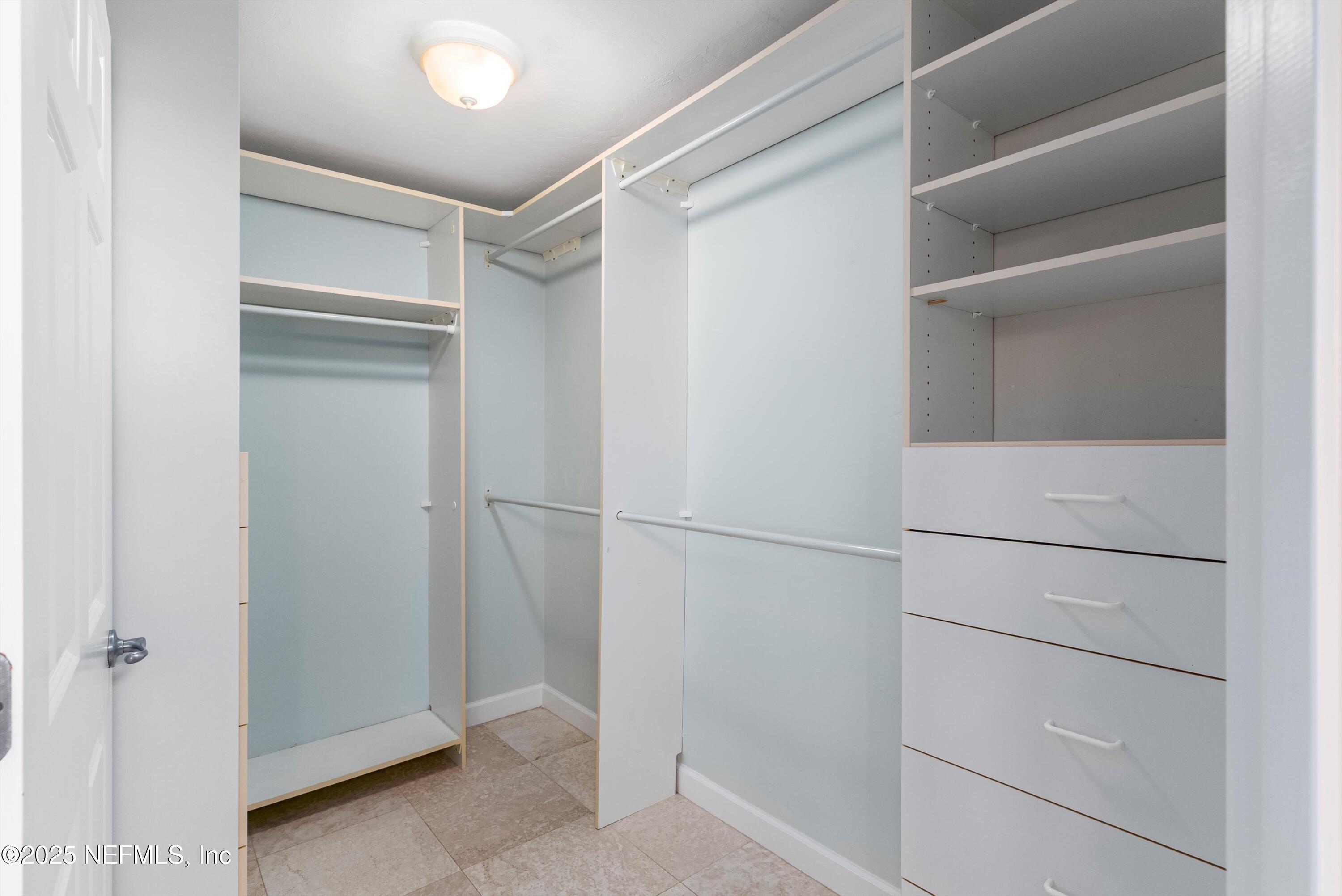 7790 A1A South, Unit 104 St. Augustine, FL 32080 - Photo 36 of 51 a view of walk in closet