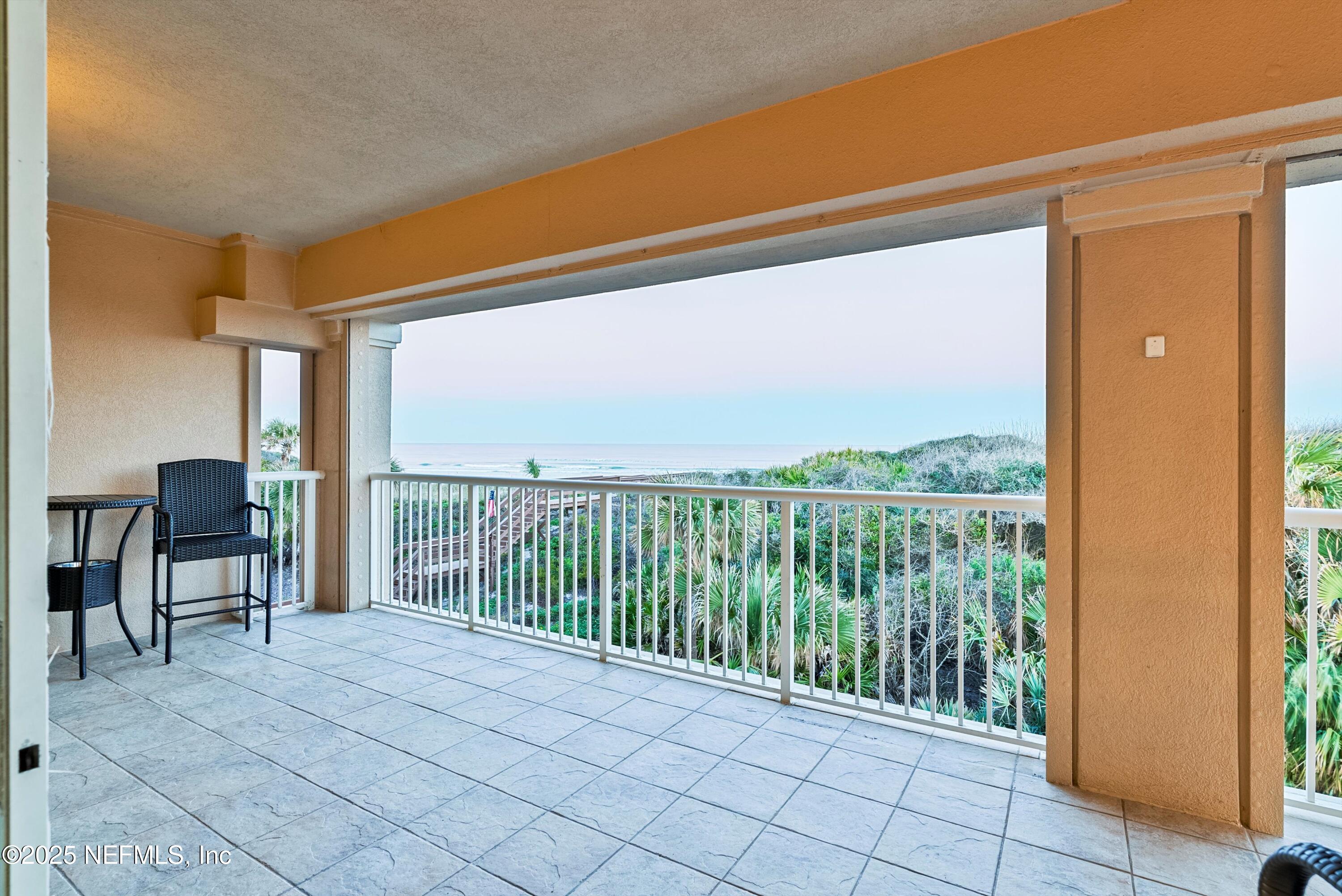 7790 A1A South, Unit 104 St. Augustine, FL 32080 - Photo 38 of 51 a view of a balcony with furniture