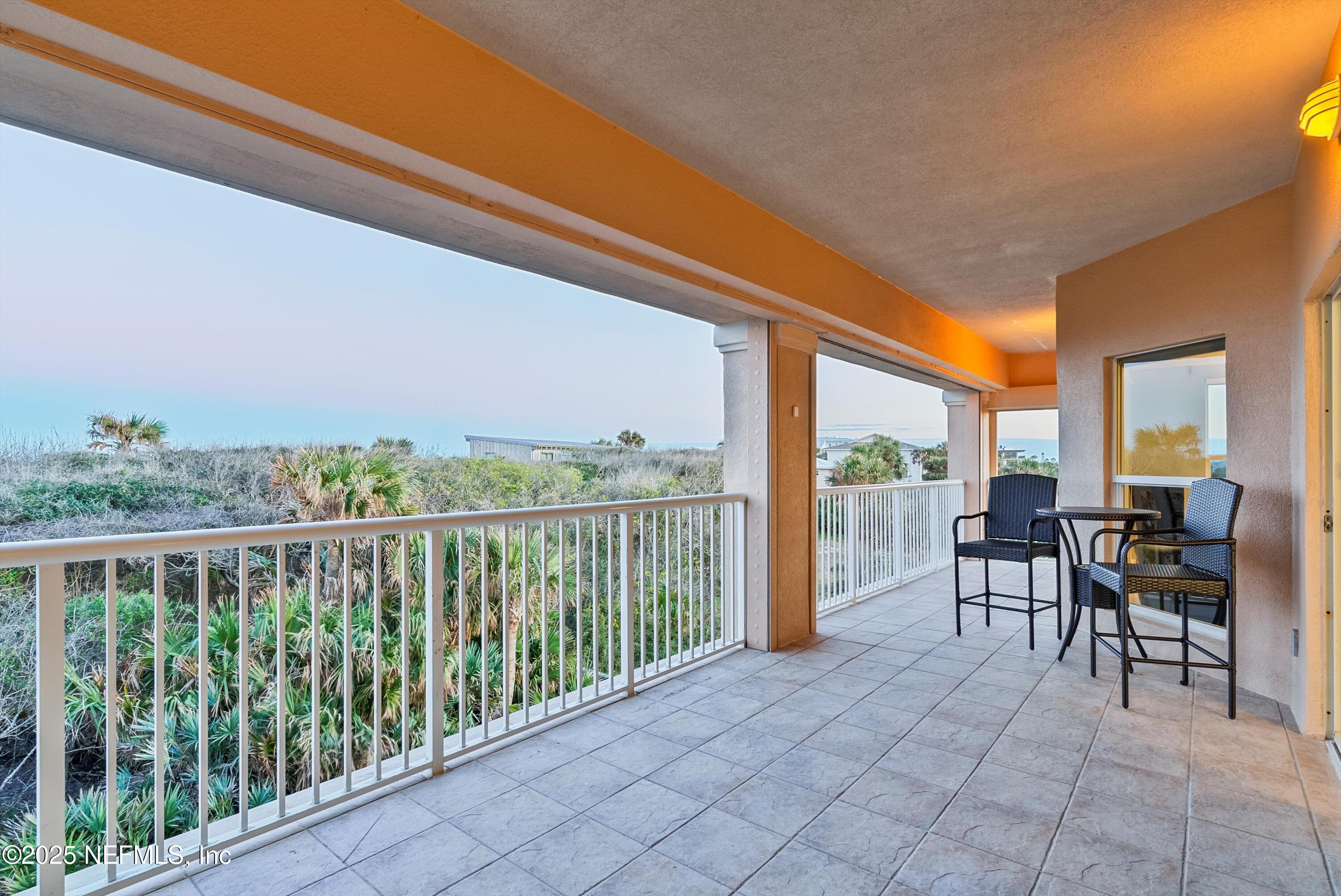 7790 A1A South, Unit 104 St. Augustine, FL 32080 - Photo 39 of 51 a view of a chairs and table in patio