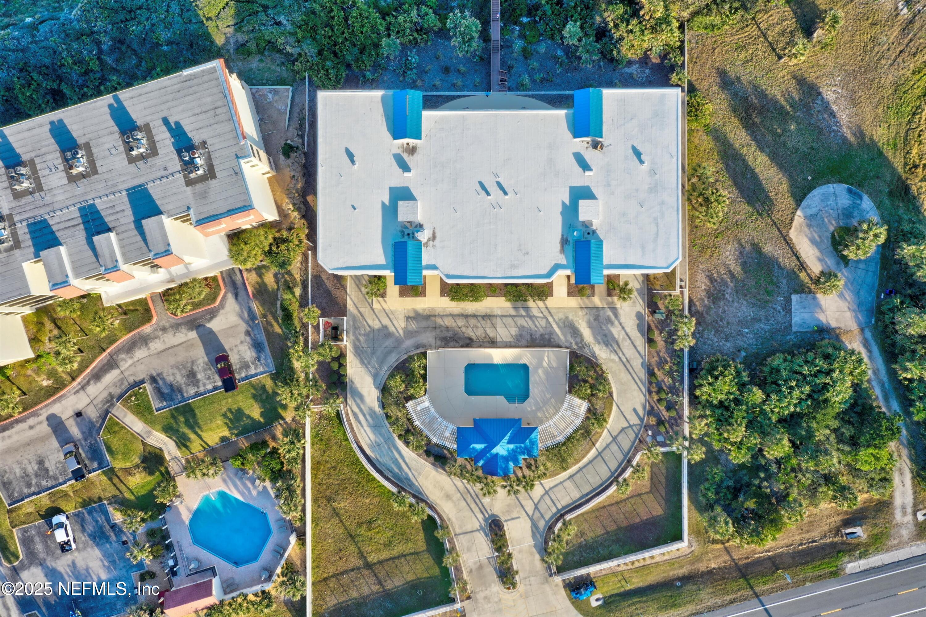 7790 A1A South, Unit 104 St. Augustine, FL 32080 - Photo 46 of 51 green and white house with outdoor seating