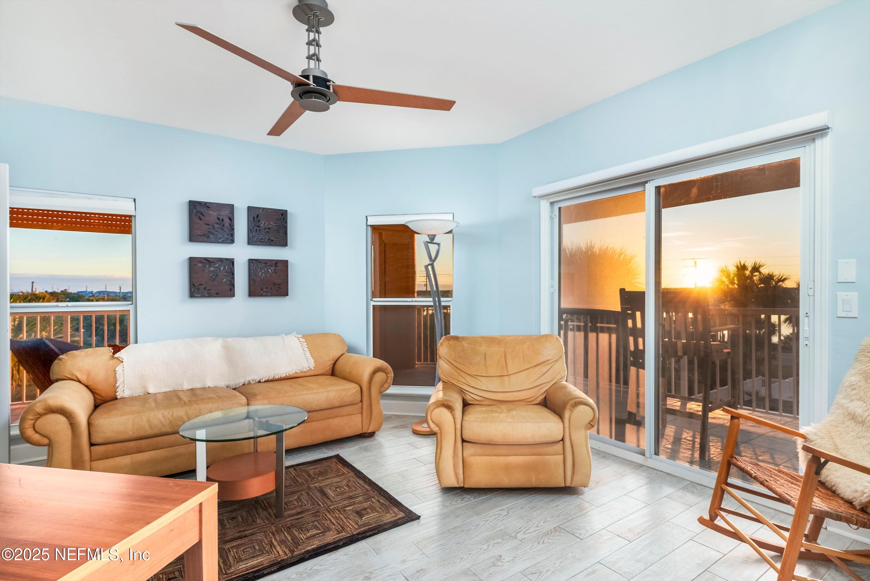 7790 A1A South, Unit 104 St. Augustine, FL 32080 - Photo 5 of 51 a living room with furniture and a large window