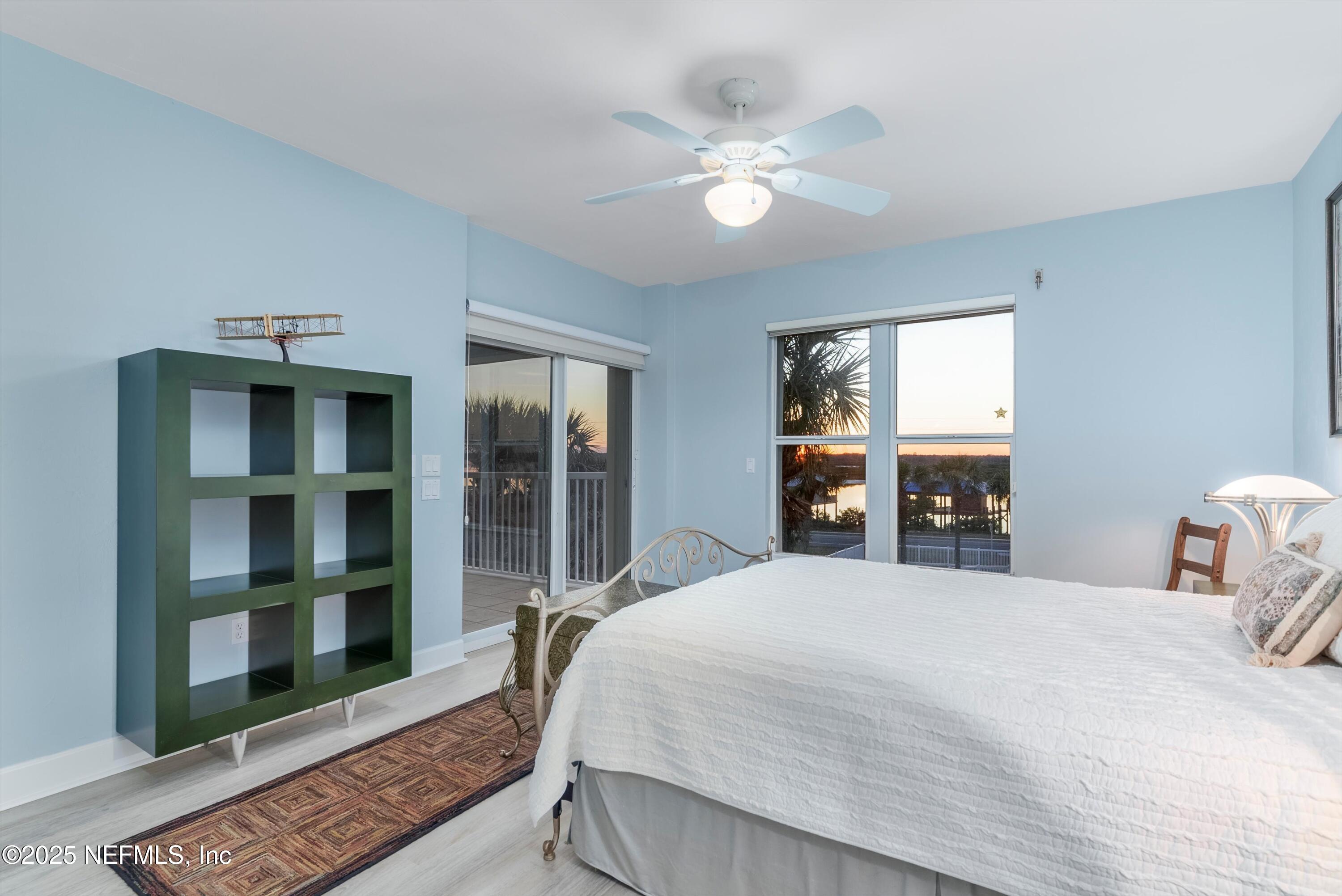 7790 A1A South, Unit 104 St. Augustine, FL 32080 - Photo 10 of 51 a bedroom with a large bed and a window