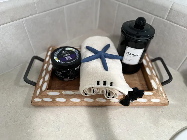 a bedroom with two beds and a night stand