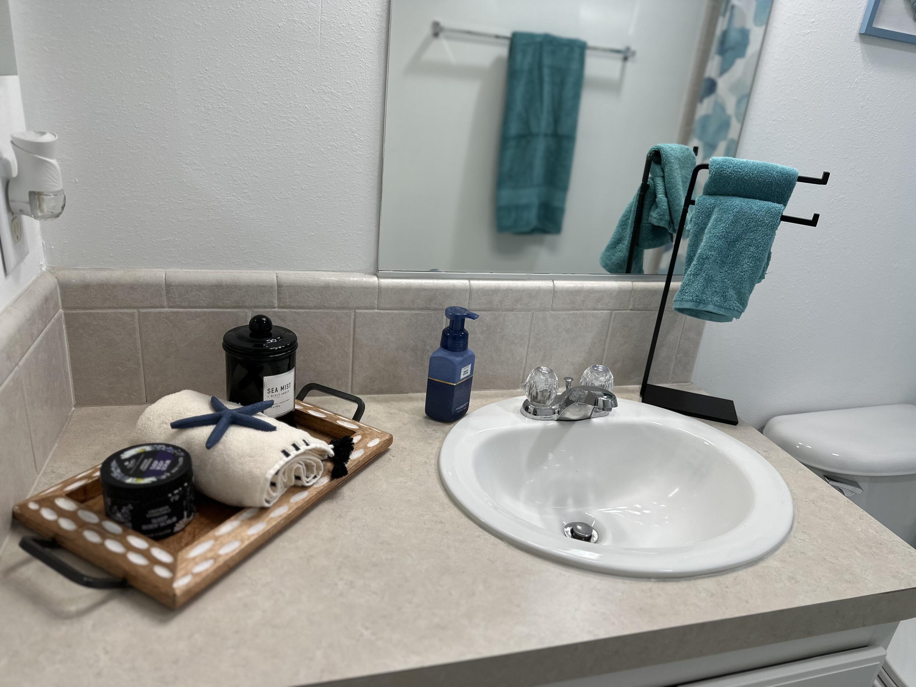 240 Taylor Drive Key Largo, FL 33037 - Photo 14 of 25 a bathroom with a sink and a mirror
