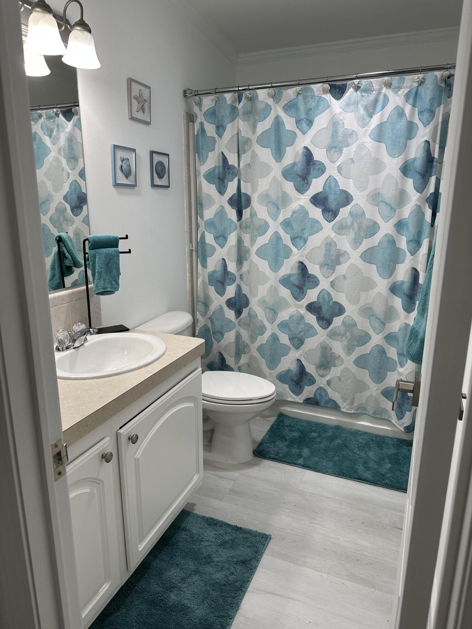240 Taylor Drive Key Largo, FL 33037 - Photo 16 of 25 a bathroom with a granite countertop sink and a mirror
