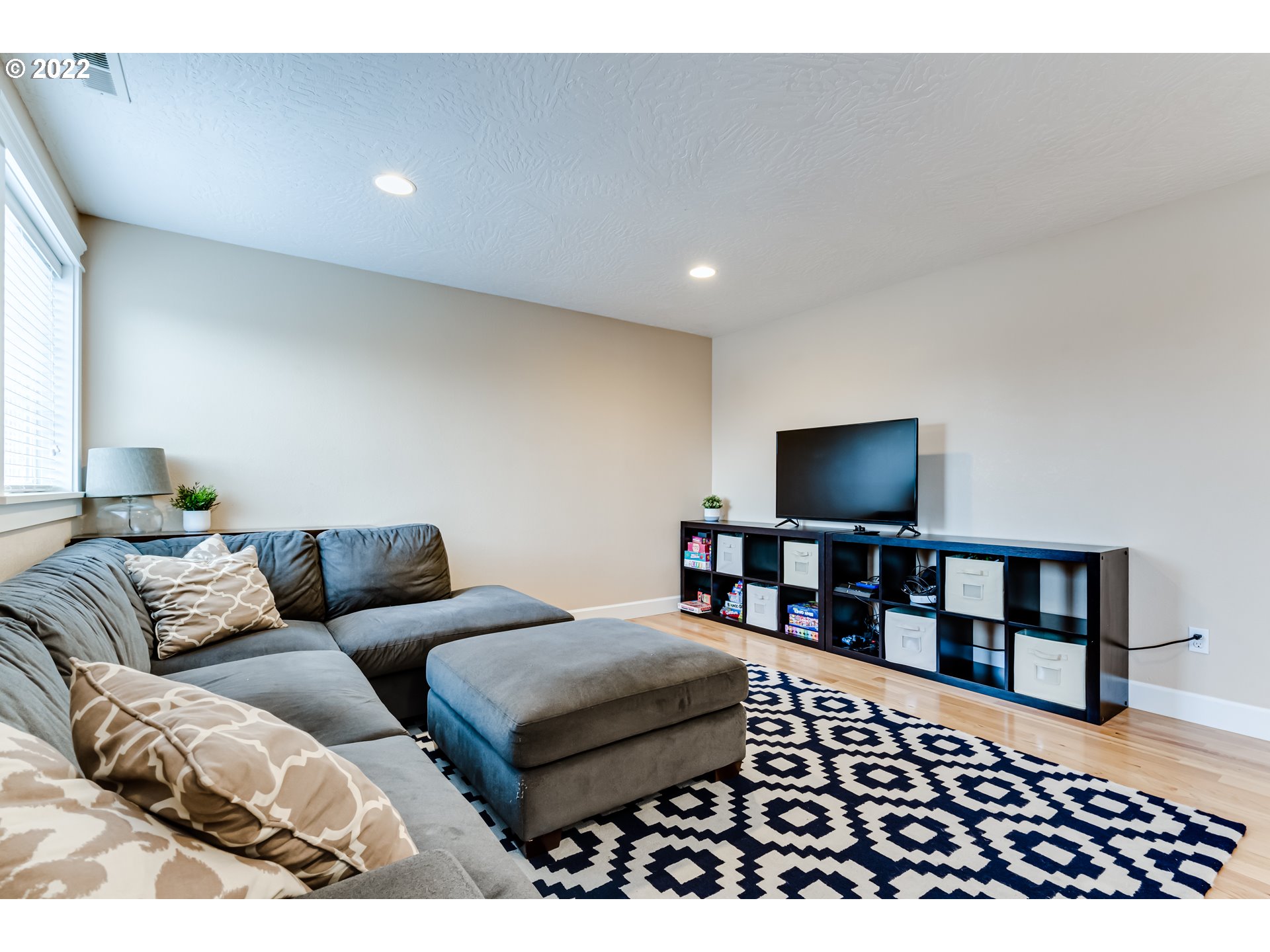5722 Peridot Way Springfield, OR 97478 - Photo 16 of 27 a living room with furniture and a flat screen tv