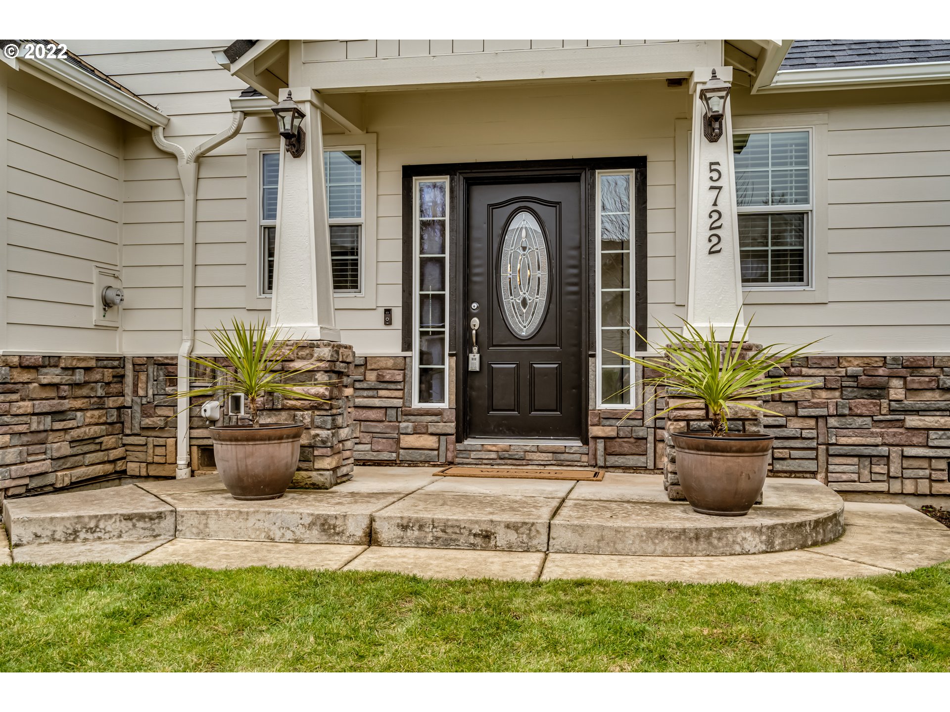 5722 Peridot Way Springfield, OR 97478 - Photo 2 of 27 a view of a house with potted plants