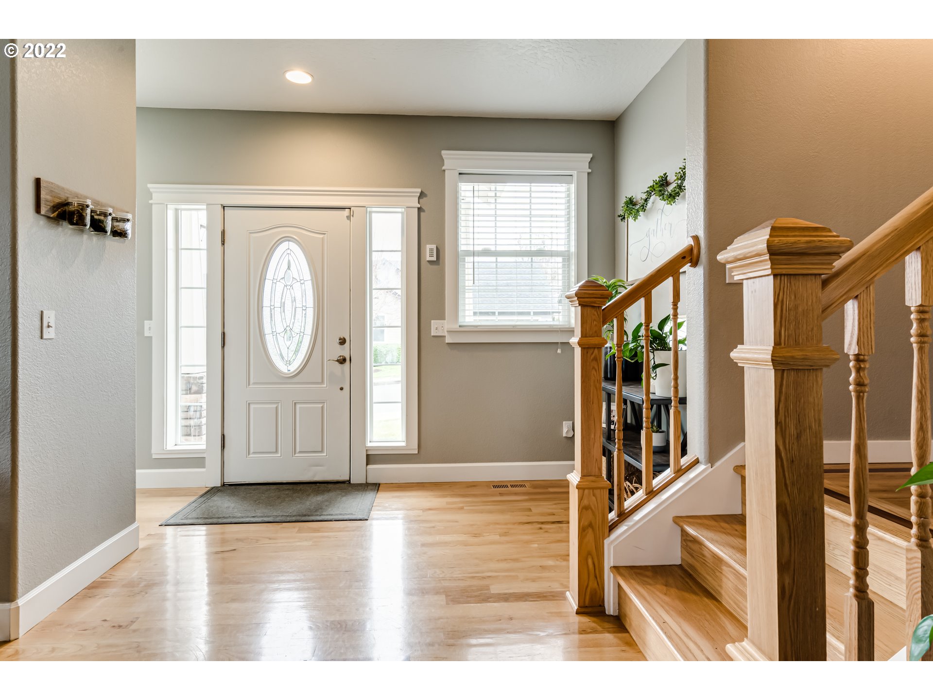 5722 Peridot Way Springfield, OR 97478 - Photo 3 of 27 a view of a hallway with wooden floor