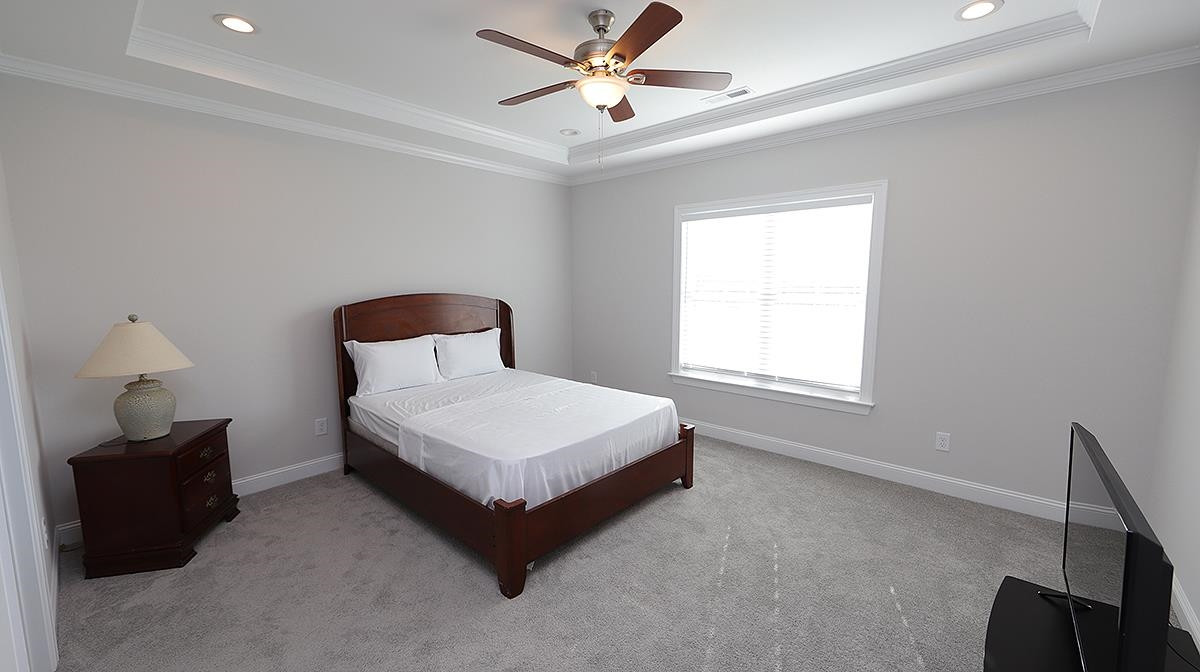 4007 Needham Road Bailey, NC 27807 - Photo 12 of 22 Nice size Primary Bedroom----Ceiling fan---trey ceiling. The space allows an area for a chair/light for reading. Primary Bedroom