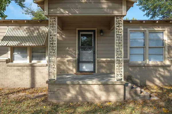 a front view of a house with a glass door