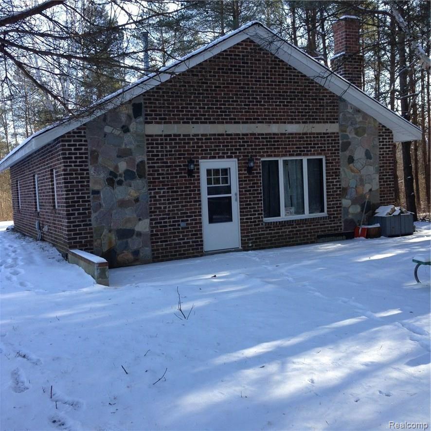 3205 Cat Lake Road Caro, MI 48723 - Photo 1 of 10 Beautiful brick and stone ranch home nestled in the woods.