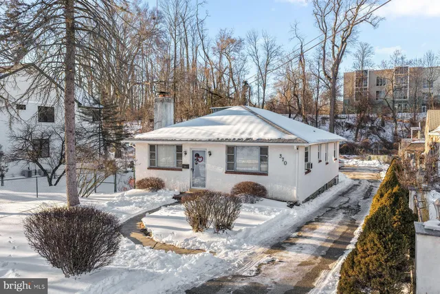 a view of a house with snow in the backyard