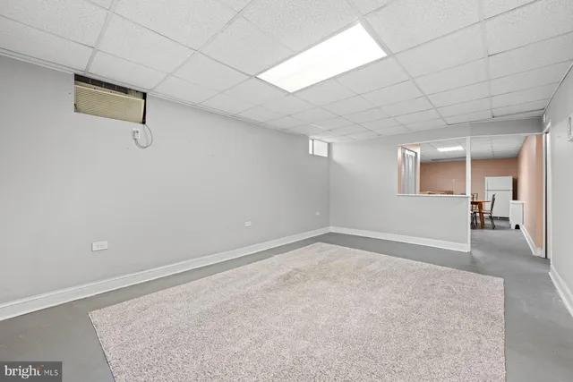 a kitchen with a table chairs a stove a sink dishwasher with a dining table and chairs