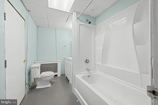 a bathroom with a shower and a bath tub