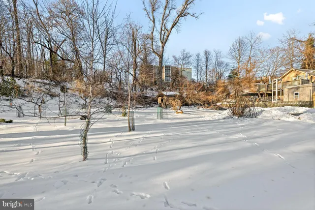 a view of snow on the side of the road