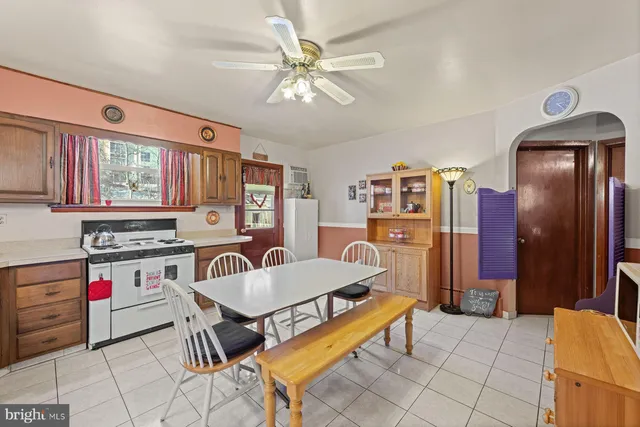 a living room with stainless steel appliances kitchen island granite countertop furniture and a kitchen view