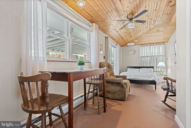 a dining room with furniture and window