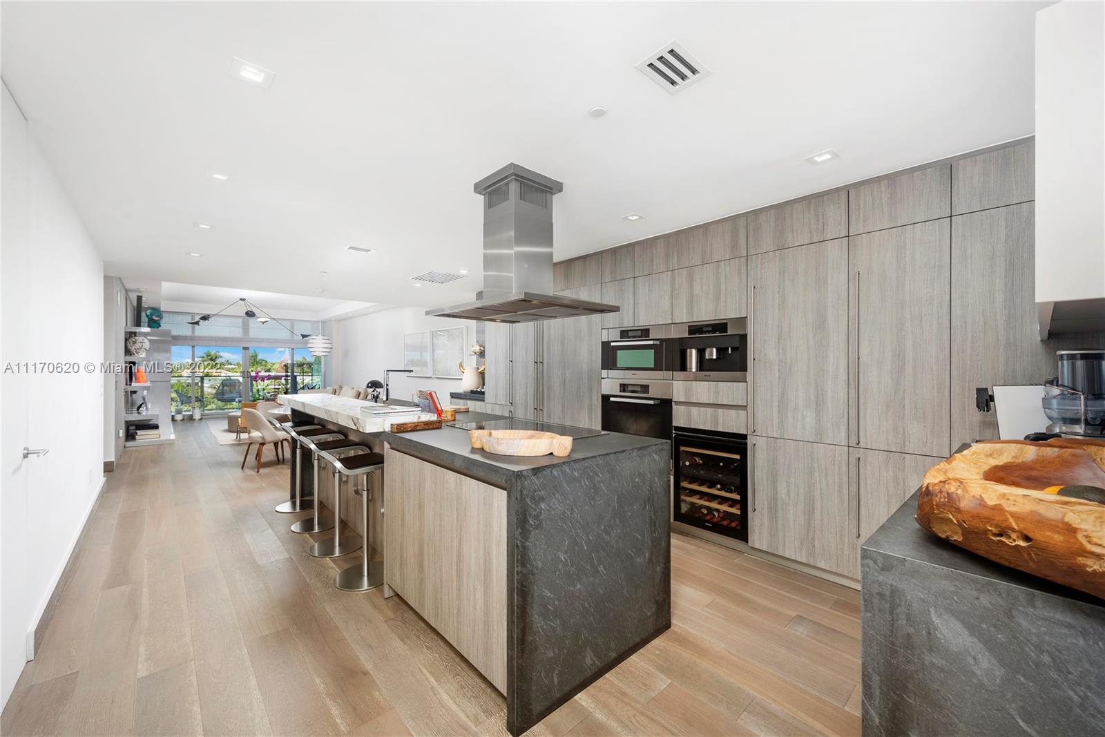 350 Ocean Drive, Unit 403N Key Biscayne, FL 33149 - Photo 11 of 55 a kitchen with stainless steel appliances granite countertop a stove and a refrigerator