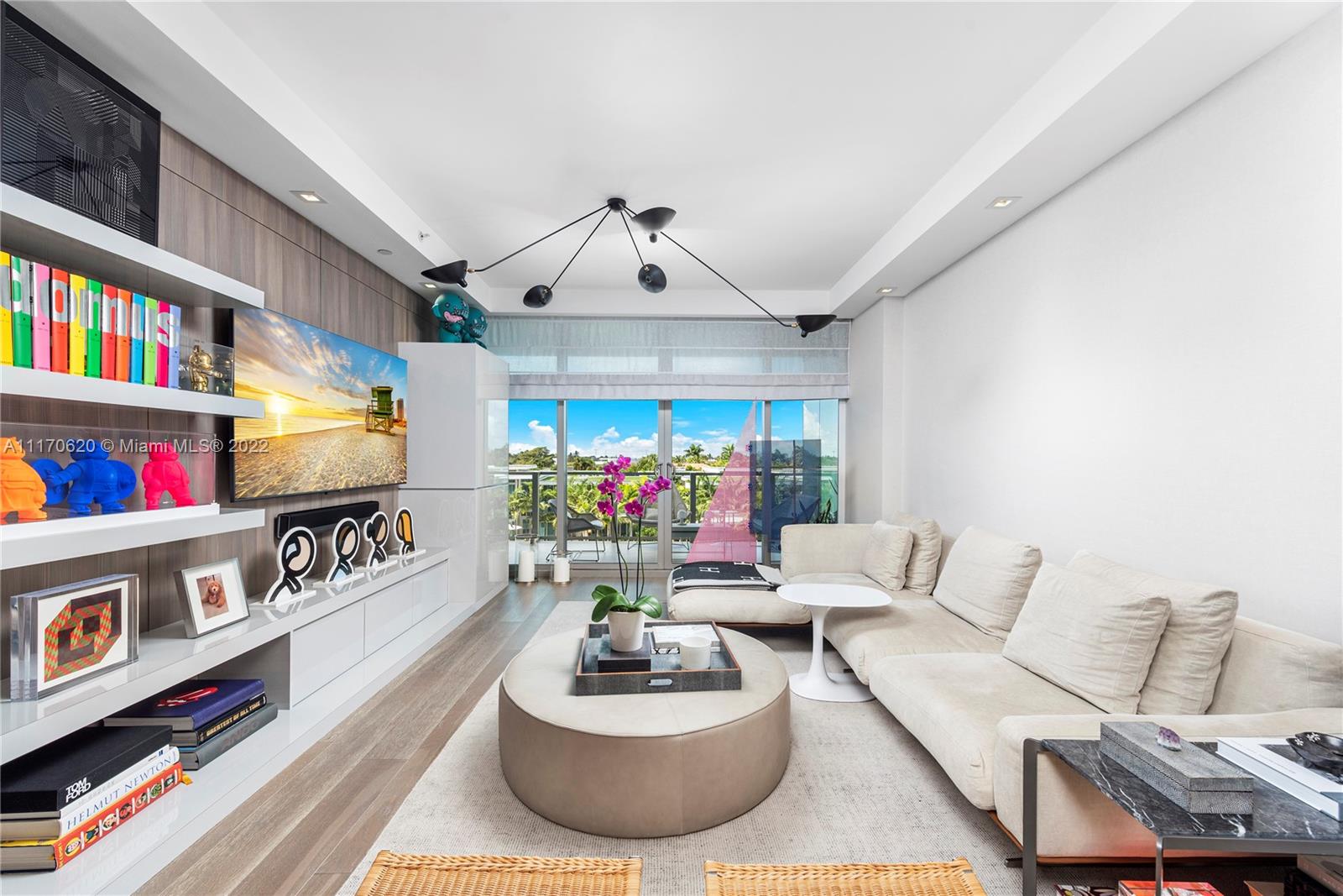 350 Ocean Drive, Unit 403N Key Biscayne, FL 33149 - Photo 20 of 55 a living room with furniture and a flat screen tv