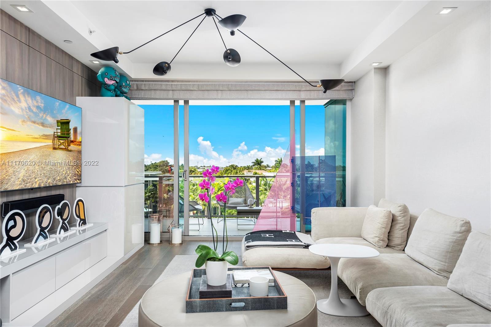 350 Ocean Drive, Unit 403N Key Biscayne, FL 33149 - Photo 21 of 55 a living room with furniture and a chandelier