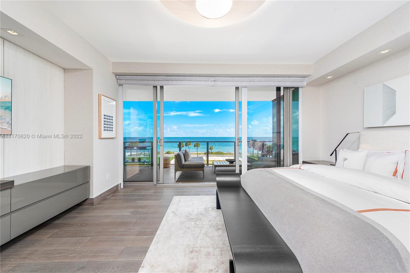 350 Ocean Drive, Unit 403N Key Biscayne, FL 33149 - Photo 23 of 55 a large bedroom with a large bed and a large window