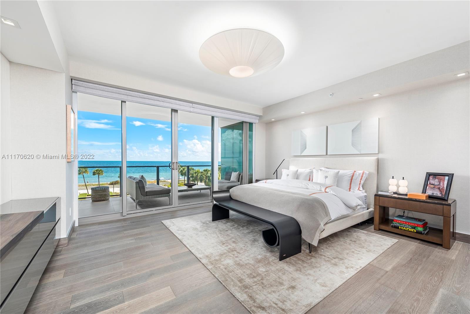 350 Ocean Drive, Unit 403N Key Biscayne, FL 33149 - Photo 24 of 55 a spacious bedroom with a bed and a large window
