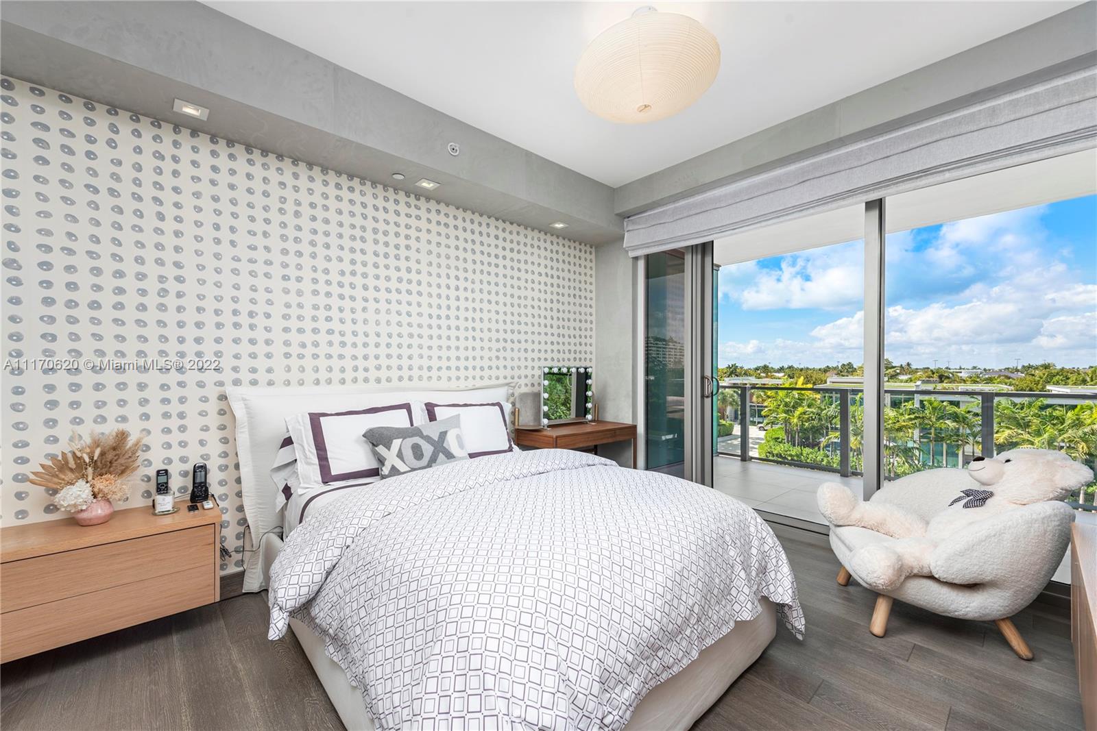 350 Ocean Drive, Unit 403N Key Biscayne, FL 33149 - Photo 29 of 55 a bedroom with a bed and large window