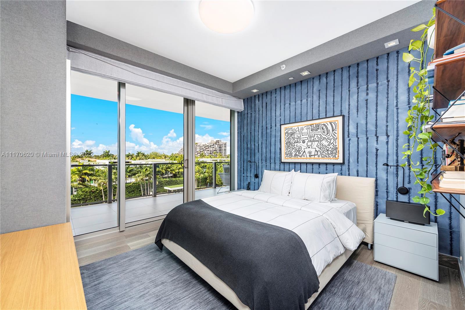 350 Ocean Drive, Unit 403N Key Biscayne, FL 33149 - Photo 32 of 55 a bedroom with a large bed and a large window