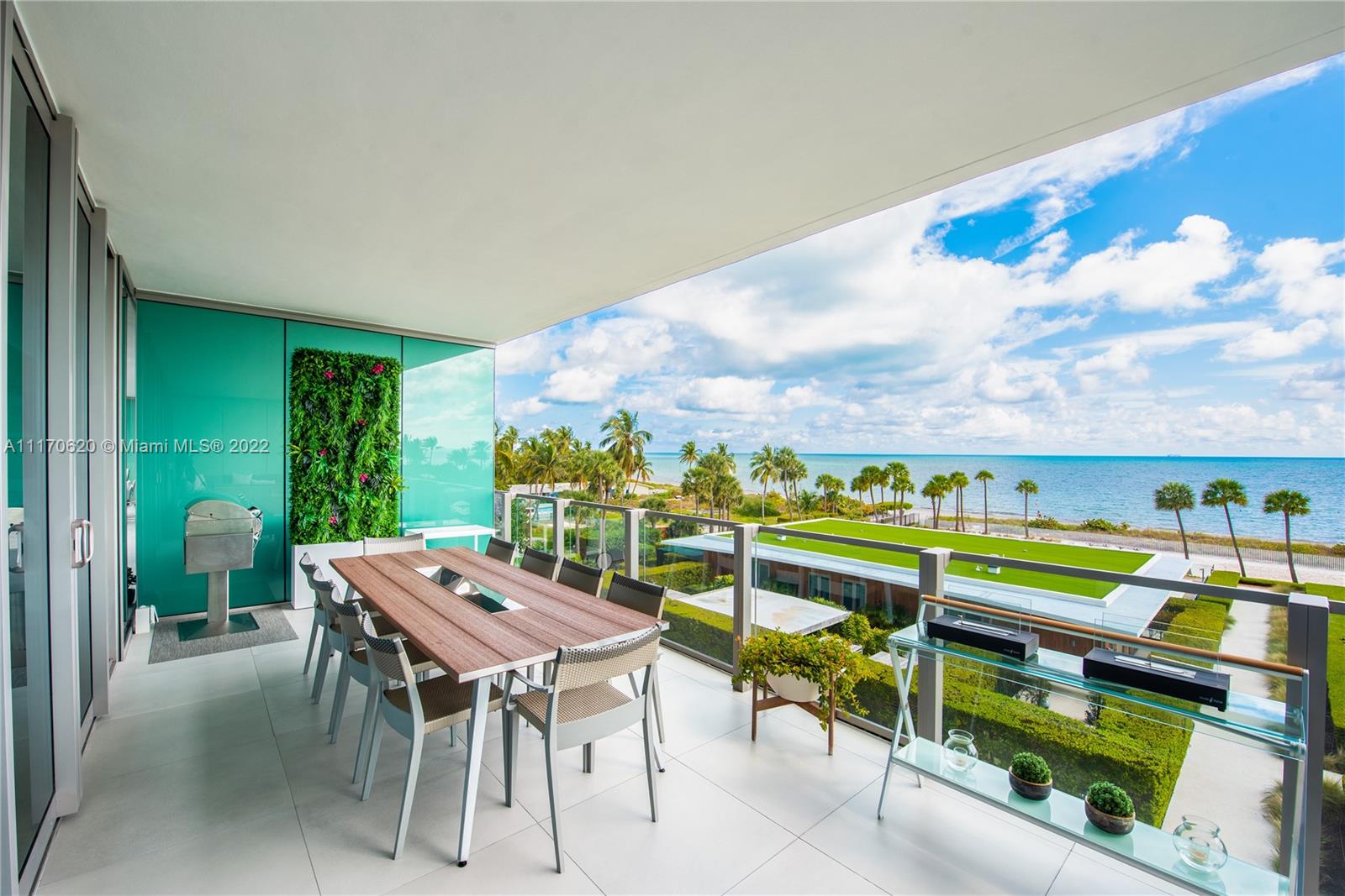 350 Ocean Drive, Unit 403N Key Biscayne, FL 33149 - Photo 42 of 55 a view of a chairs and table in a patio
